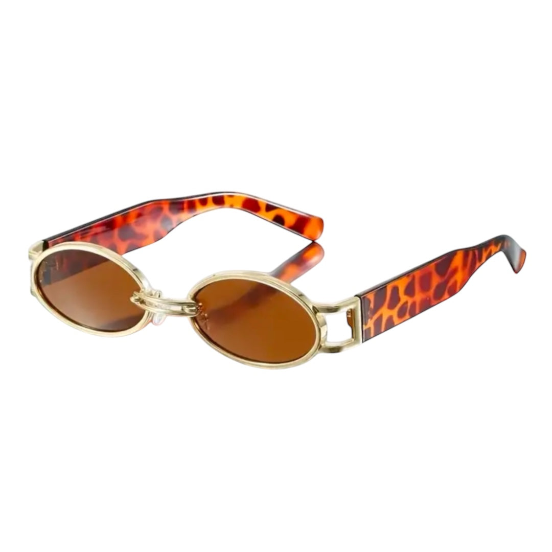 A pair of vintage 90s style sunglasses with gold frame and black lenses.