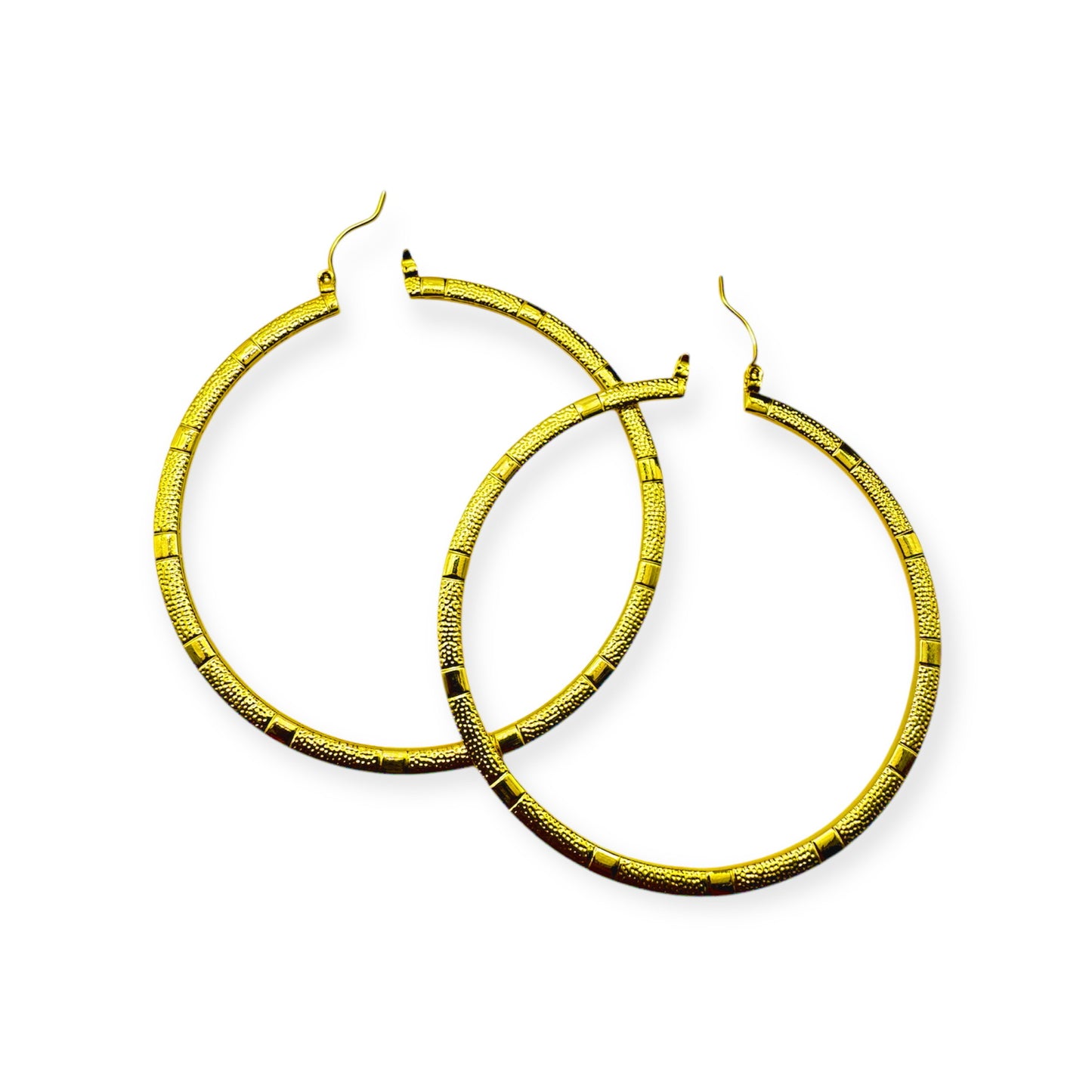 Circular bamboo earrings by Everythang Dope, vintage 80s and 90s fashion.A pair of vintage gold hoop earrings with a textured surface.