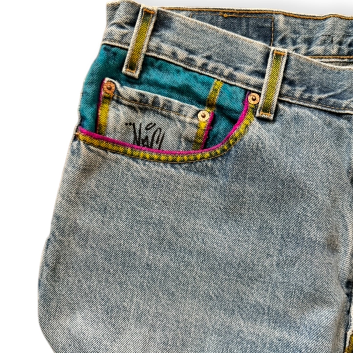 Custom denim jeans with Naclie Jawn multicolor graffiti by Everythang Dope, one-of-one streetwear.