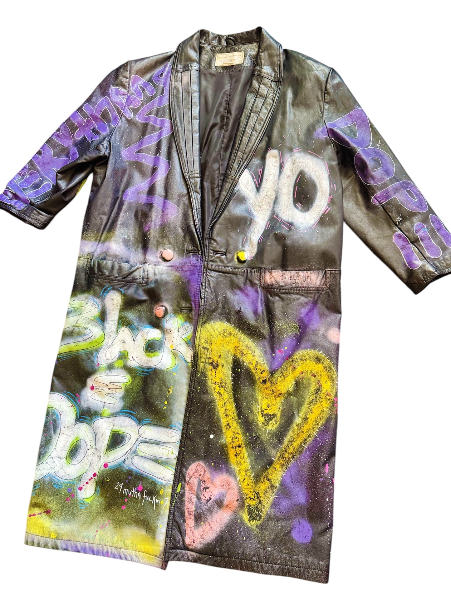 Graffiti-painted 80s leather trench coat from Everythang Dope, bold retro outerwear.