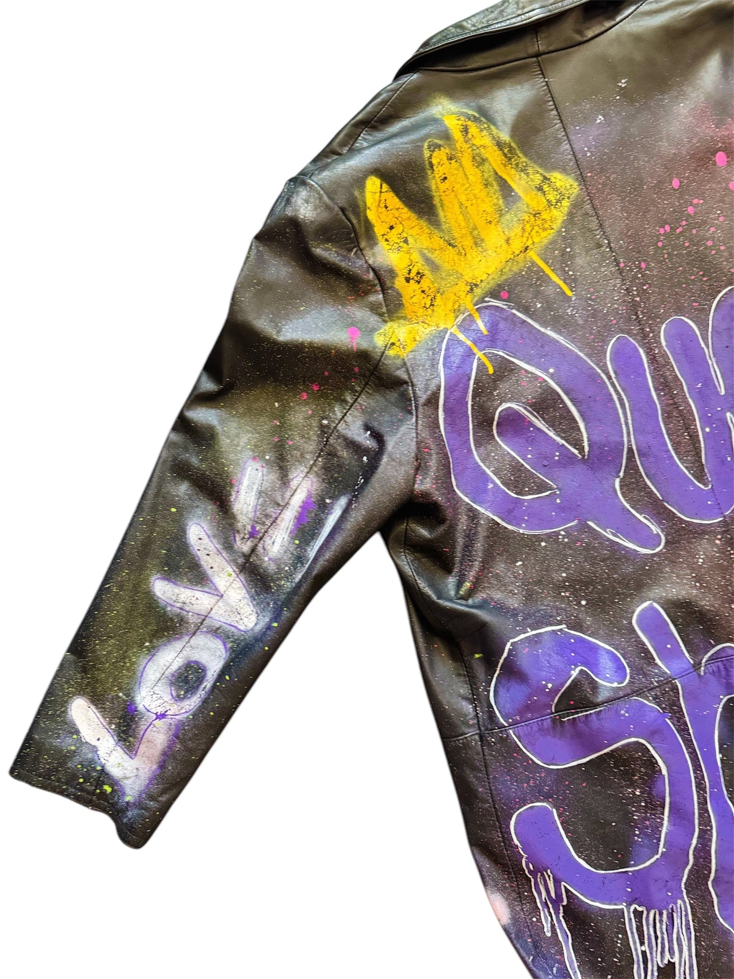 Graffiti-painted 80s leather trench coat from Everythang Dope, bold retro outerwear.