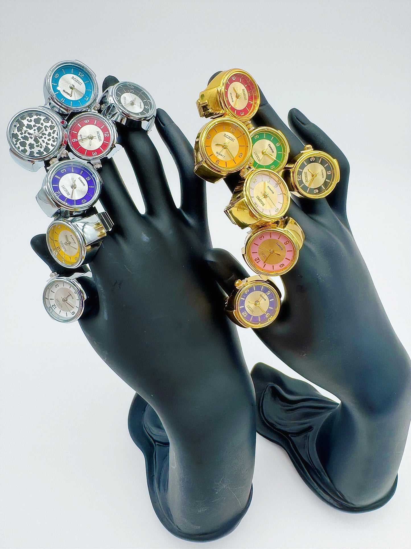Mannequin hands wearing assorted vintage ring watches by Everythang Dope.