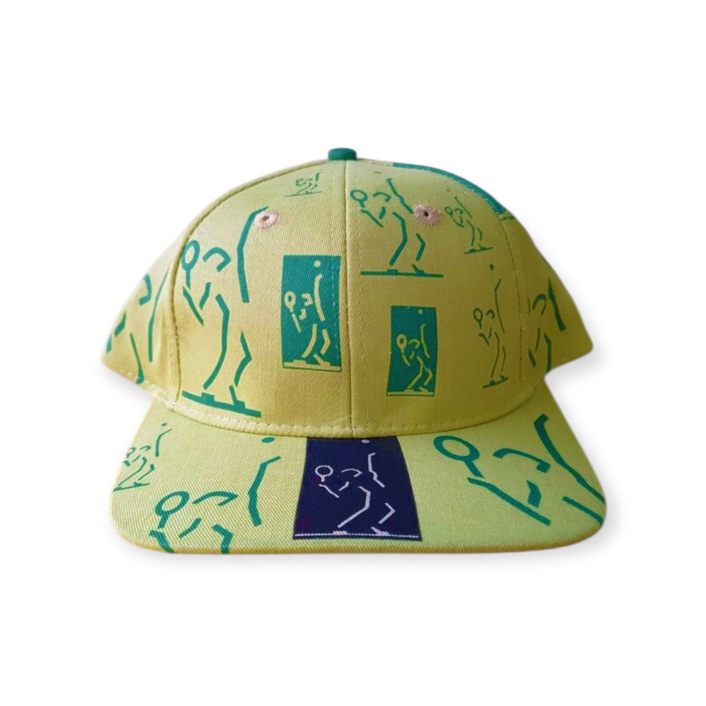 A vintage yellow and green cap with character illustrations and abstract designs