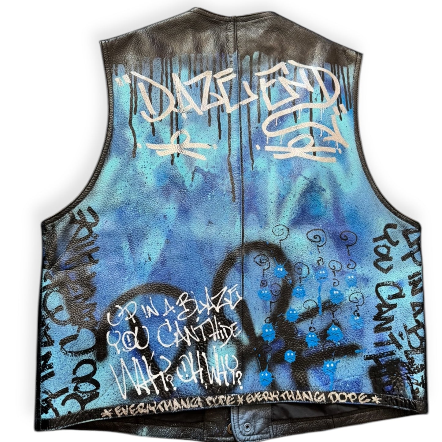 Custom painted black and blue denim vest with text and abstract designs in spray paint.