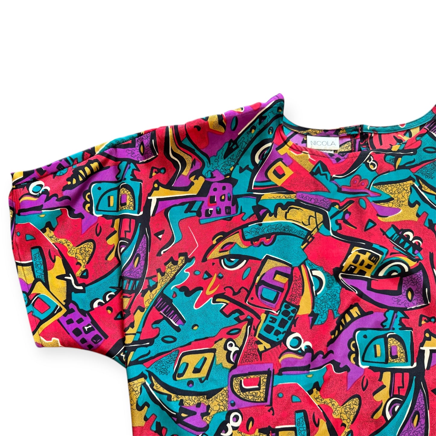 Vintage red 80s top with abstract Art Deco design, retro fashion from Everythang Dope.
