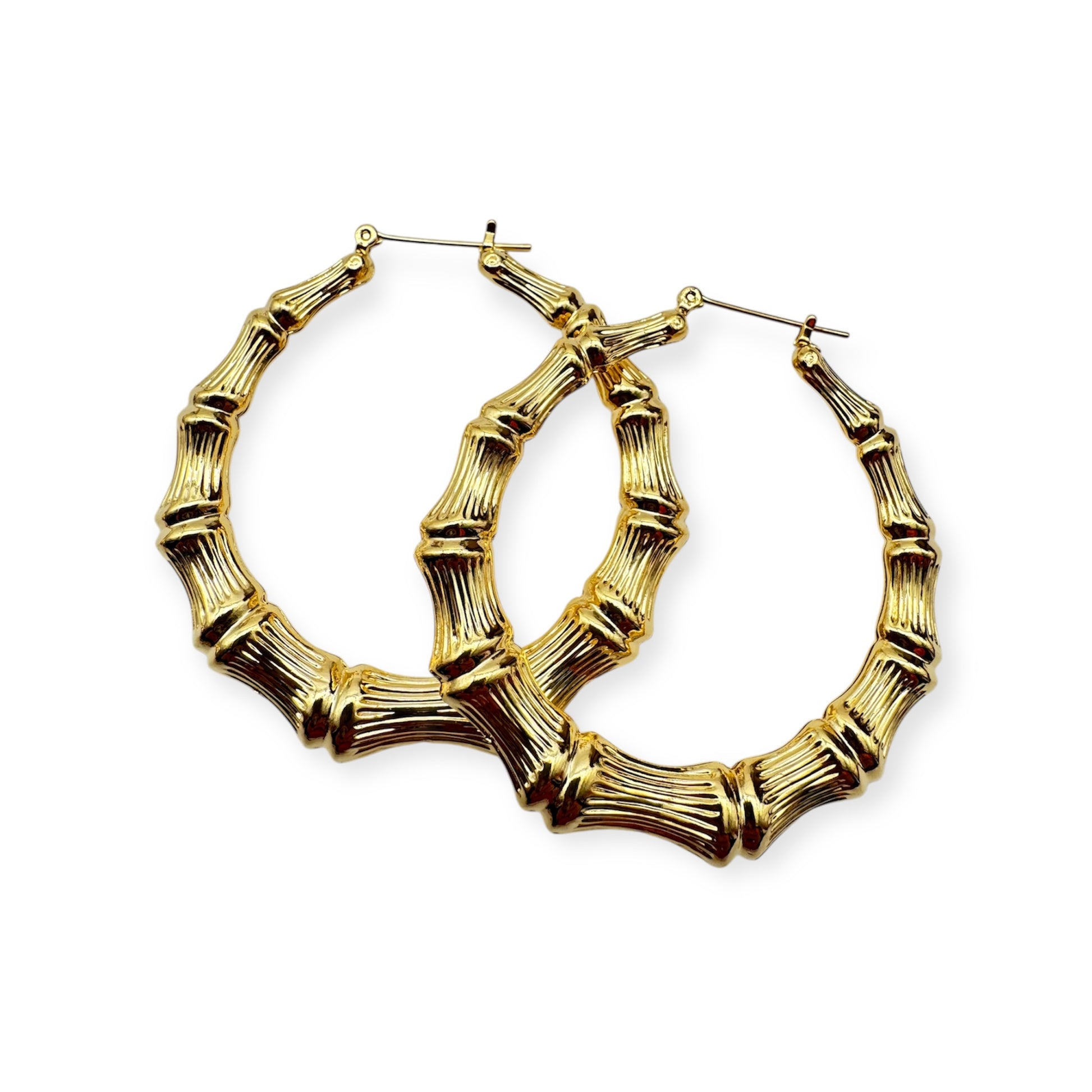 A pair of vintage gold hoop earrings with a textured surface.  Gold bamboo hoop earrings by Everythang Dope, inspired by 90s streetwear.