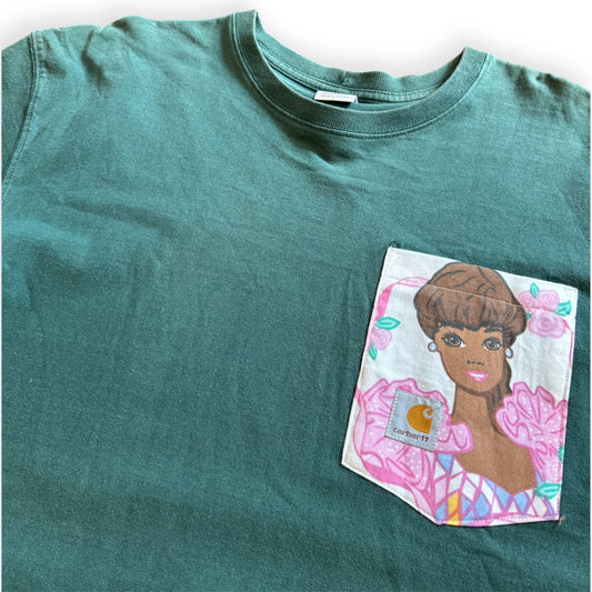One-of-one custom tee shirt by Everythang Dope, hand-designed vintage fashion. A green Carhartt t-shirt with a custom graphic of a cartoon character on the pocket.