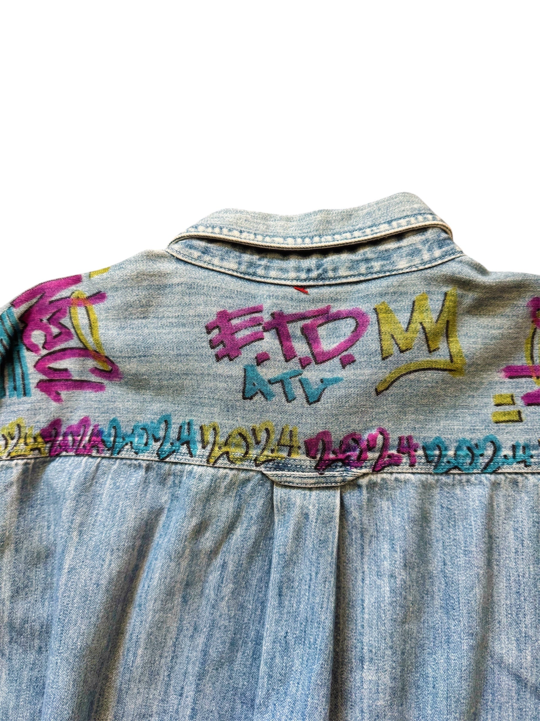 Custom denim jeans with Naclie Jawn multicolor graffiti by Everythang Dope, one-of-one streetwear.