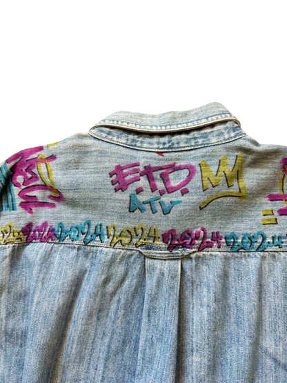 Custom denim jeans with Naclie Jawn multicolor graffiti by Everythang Dope, one-of-one streetwear.