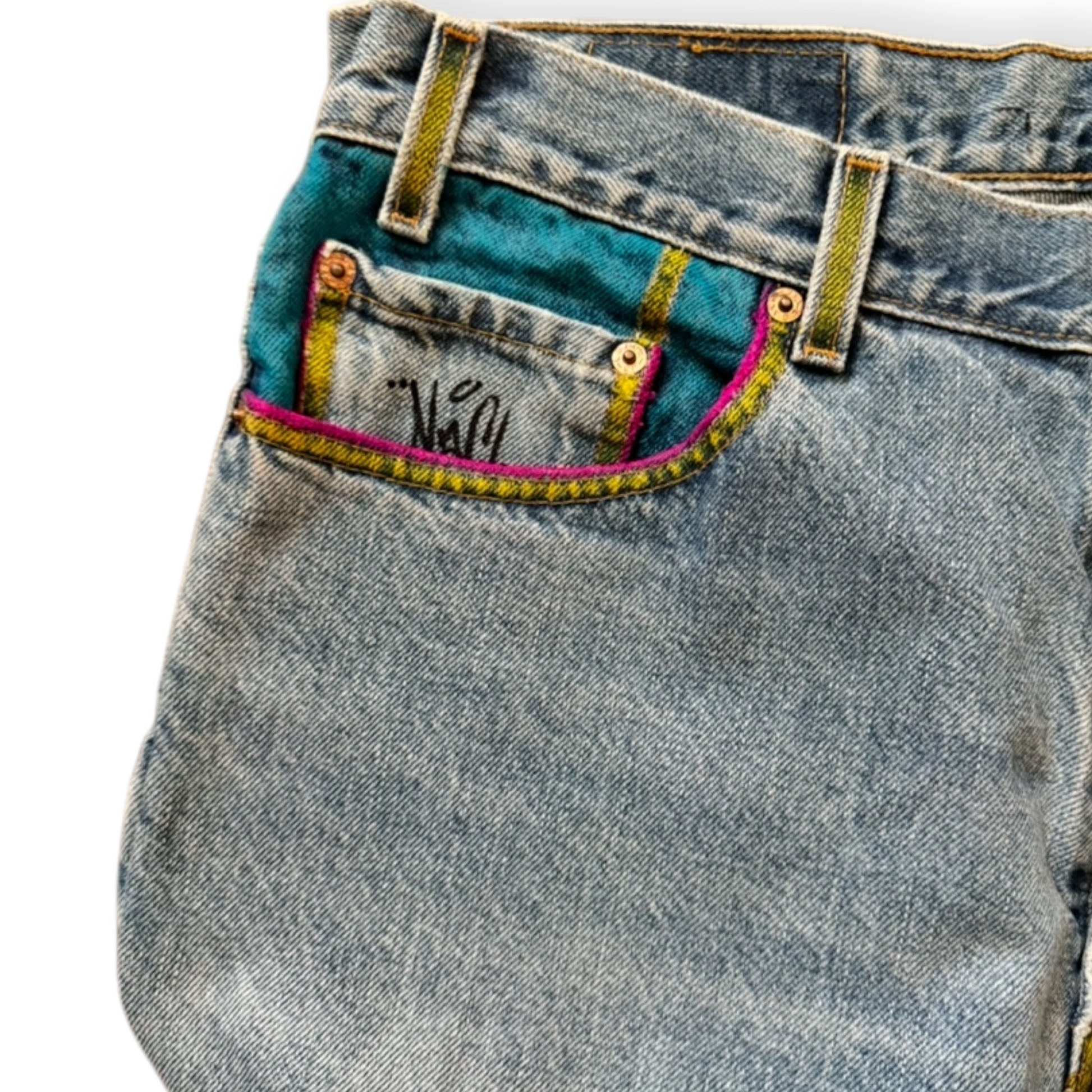 Custom denim jeans with Naclie Jawn multicolor graffiti by Everythang Dope, one-of-one streetwear.