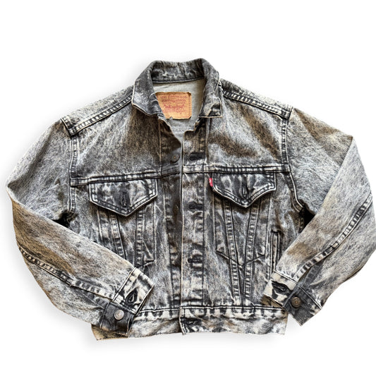 A black acid wash Levi's denim jacket laid out flat on a white background.