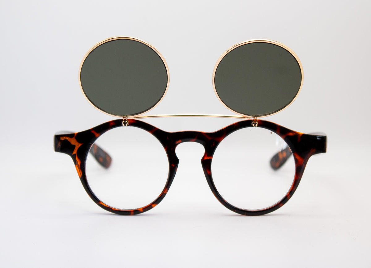 Front view of vintage Dwayne Wayne style flip-up sunglasses with round clear lenses and dark flip-up dark lenses on a tortoise shell frame by Everythang Dope.
everythang dope vintage sunglasses, 90s round flip up glasses, retro a different world glasses, hip hop streetwear eyewear
