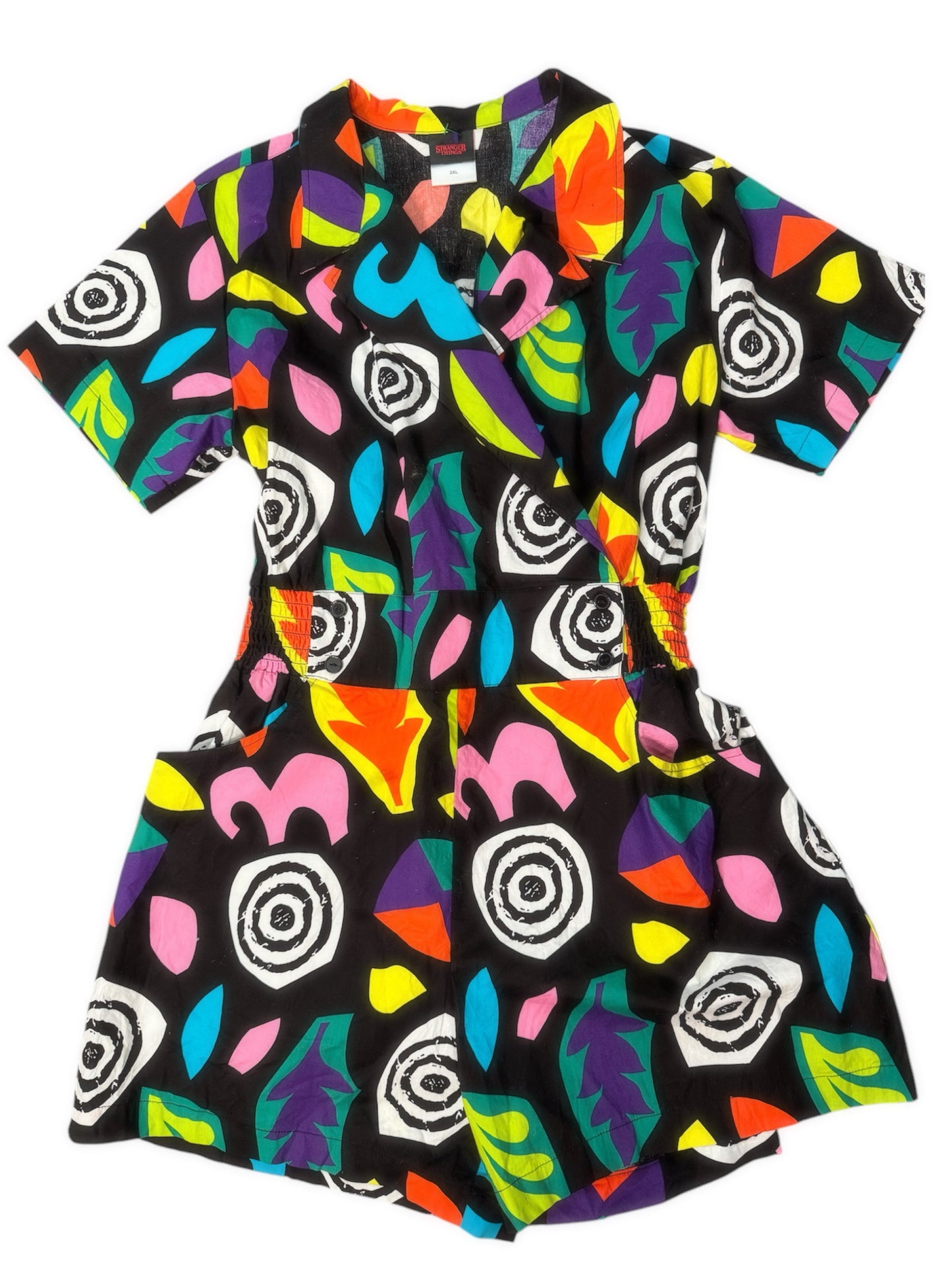 A colorful 80s one-piece with a geometric pattern in multiple colors.