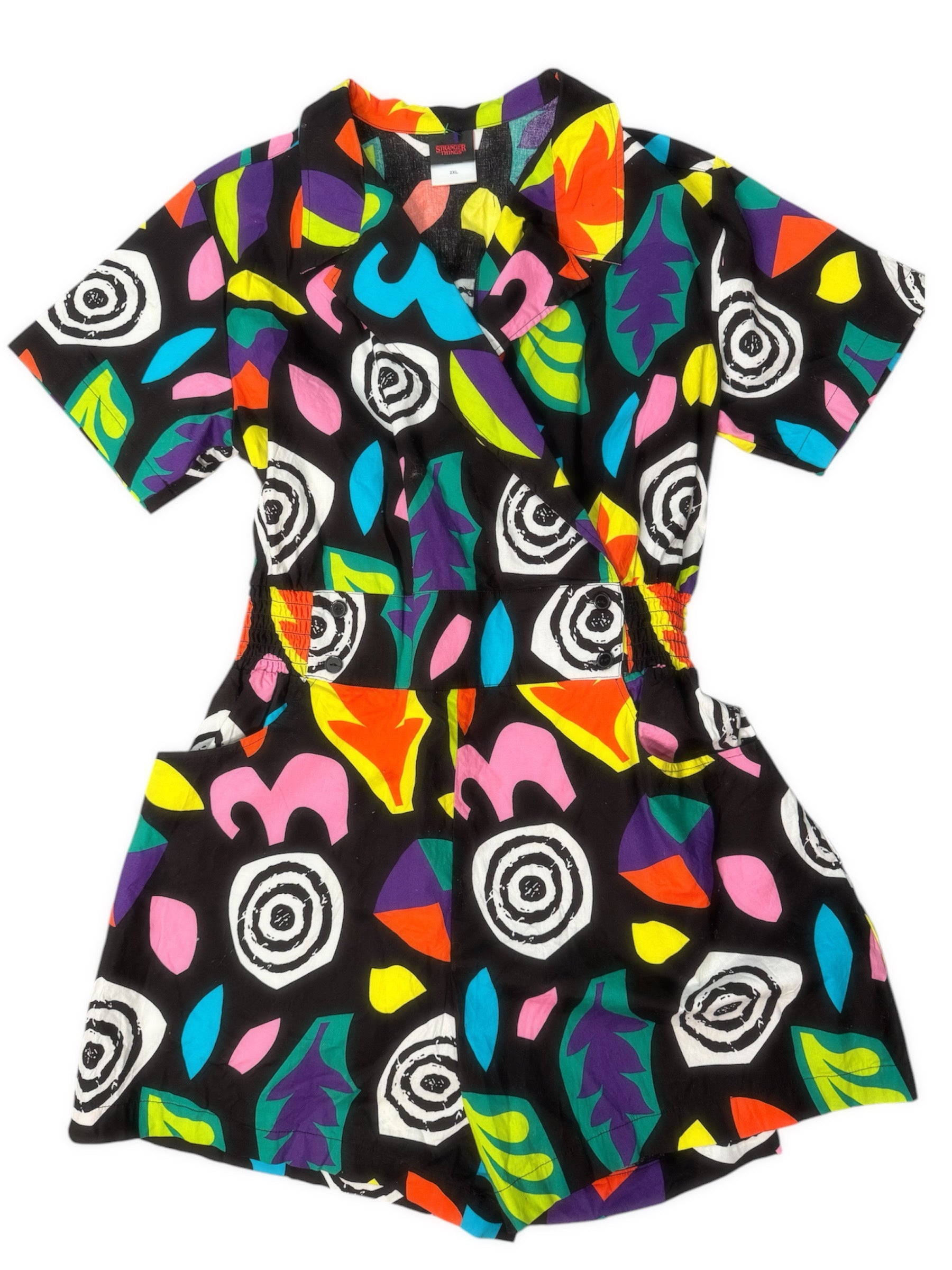 A colorful 80s one-piece with a geometric pattern in multiple colors.