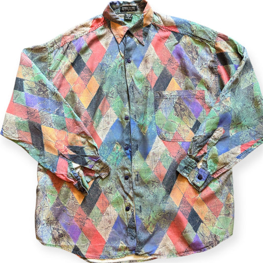 A multicolored geometric patterned button-up shirt from the 1990s. 1990s geometric patterned button-up shirt by Everythang Dope, colorful retro fashion.