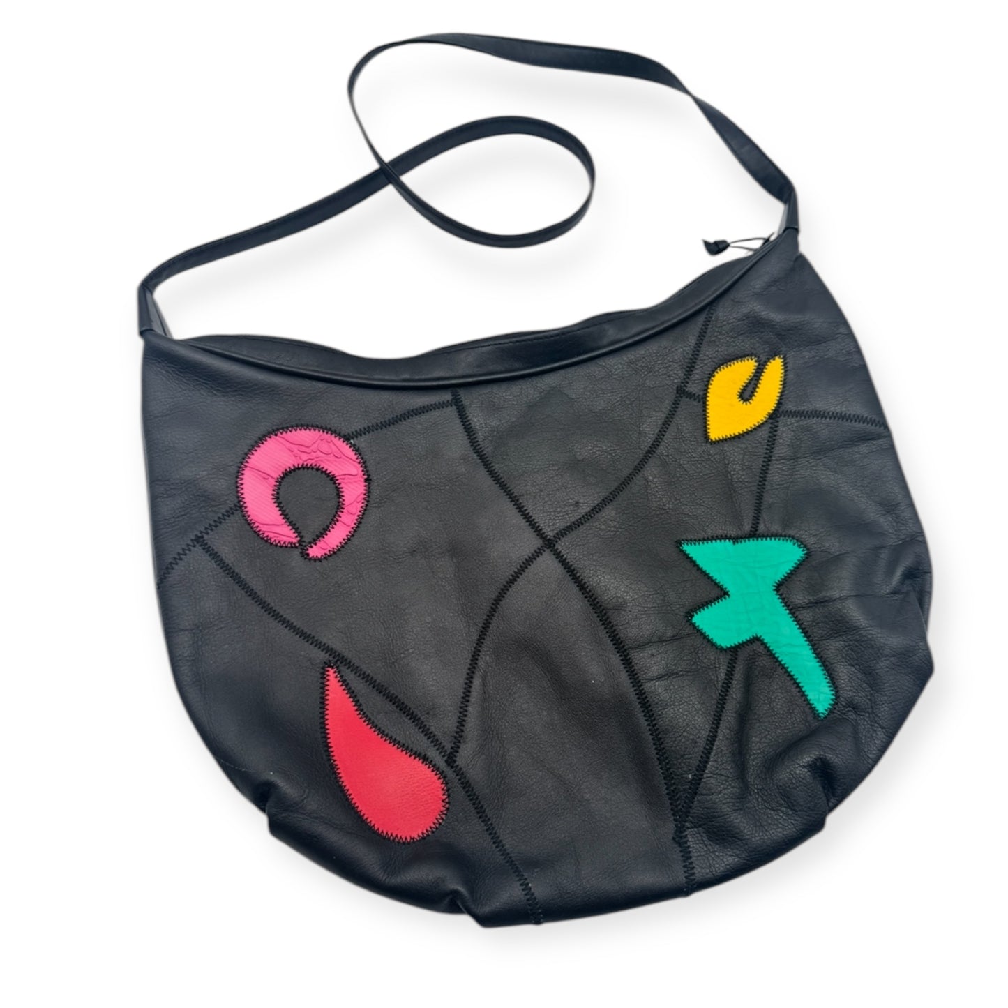 Multicolor leather patchwork vintage bag from Everythang Dope, bold 80s accessory.