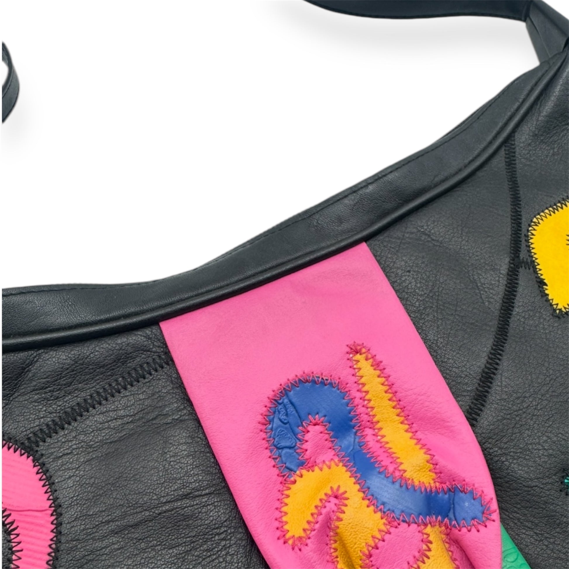 Multicolor leather patchwork vintage bag from Everythang Dope, bold 80s accessory.