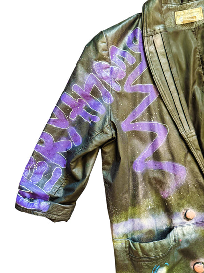 Graffiti-painted 80s leather trench coat from Everythang Dope, bold retro outerwear.
