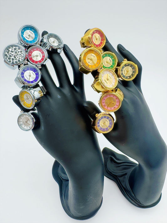 Mannequin hands wearing assorted vintage ring watches by Everythang Dope.