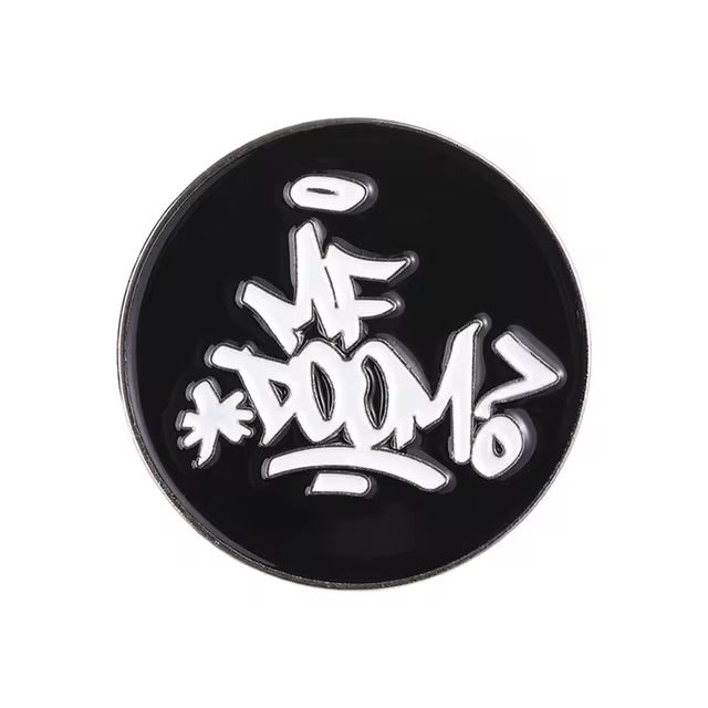 MF Doom pin by Everythang Dope, hip-hop legend tribute accessory.