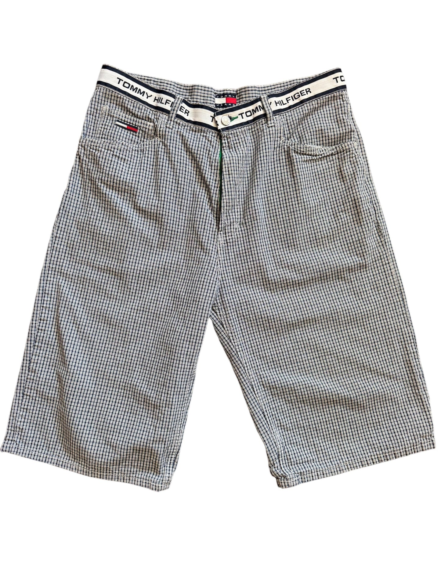 A pair of Tommy Hilfiger plaid shorts with a bold plaid pattern in a light color.