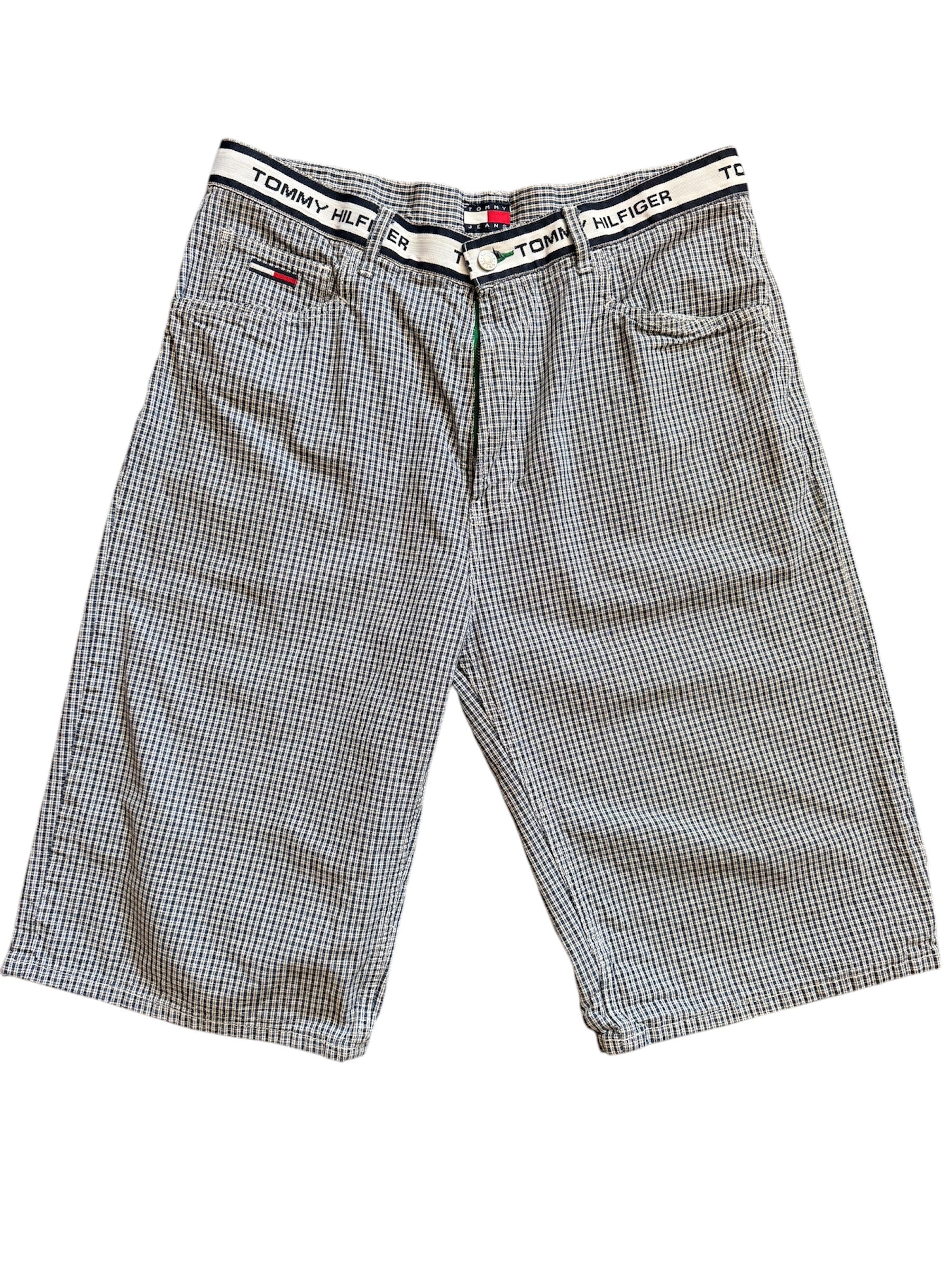 A pair of Tommy Hilfiger plaid shorts with a bold plaid pattern in a light color.