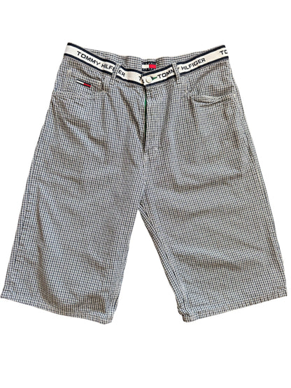 A pair of Tommy Hilfiger plaid shorts with a bold plaid pattern in a light color.